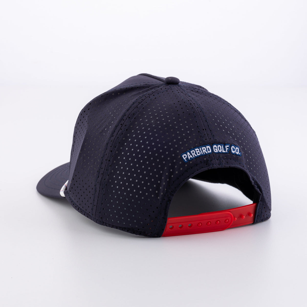 The Low Harpy Snap in Navy with White/Red/Royal rope, back view with red snap